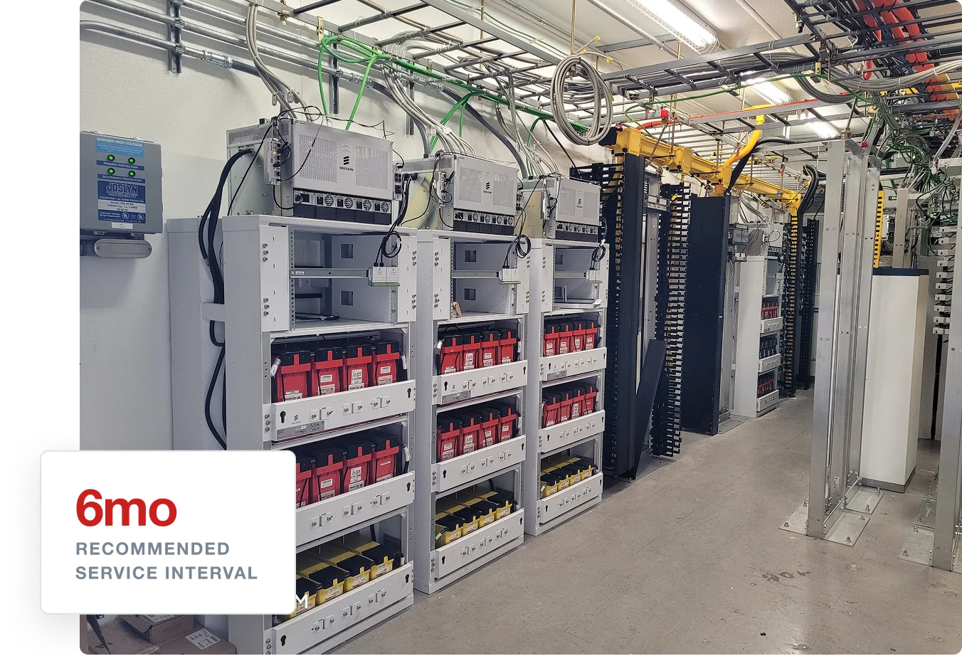 LCE Telecom power equipment room with battery racks, network systems, and organized cabling, labeled with a six-month service interval.